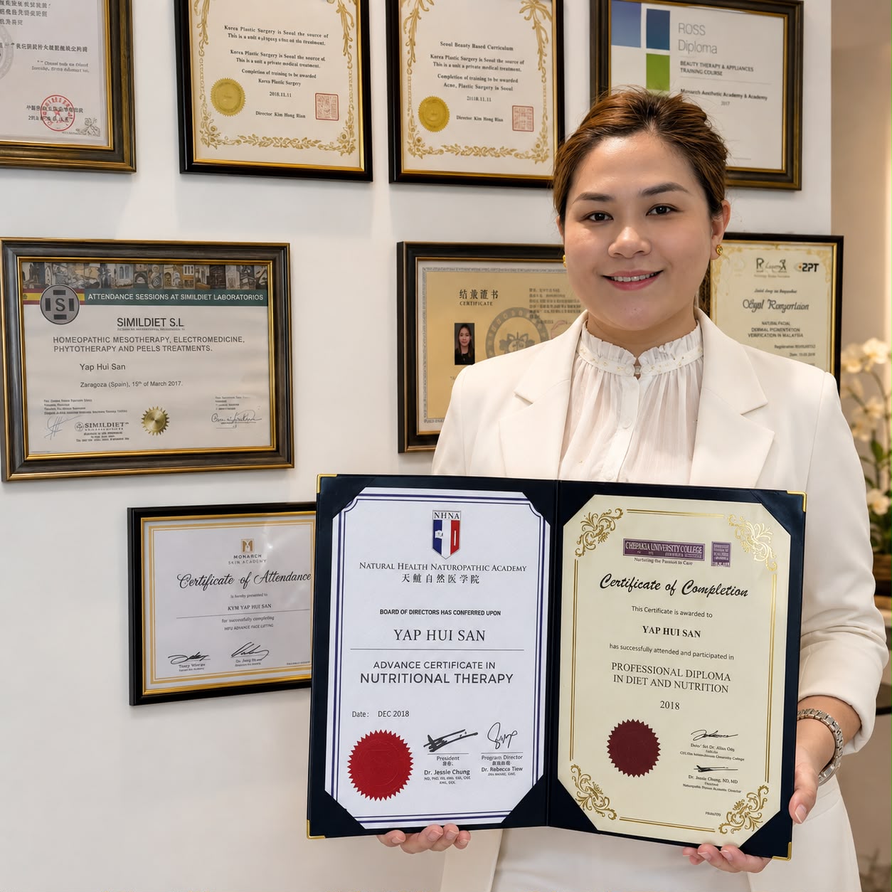 B&C aesthetic professional presenting her certificates